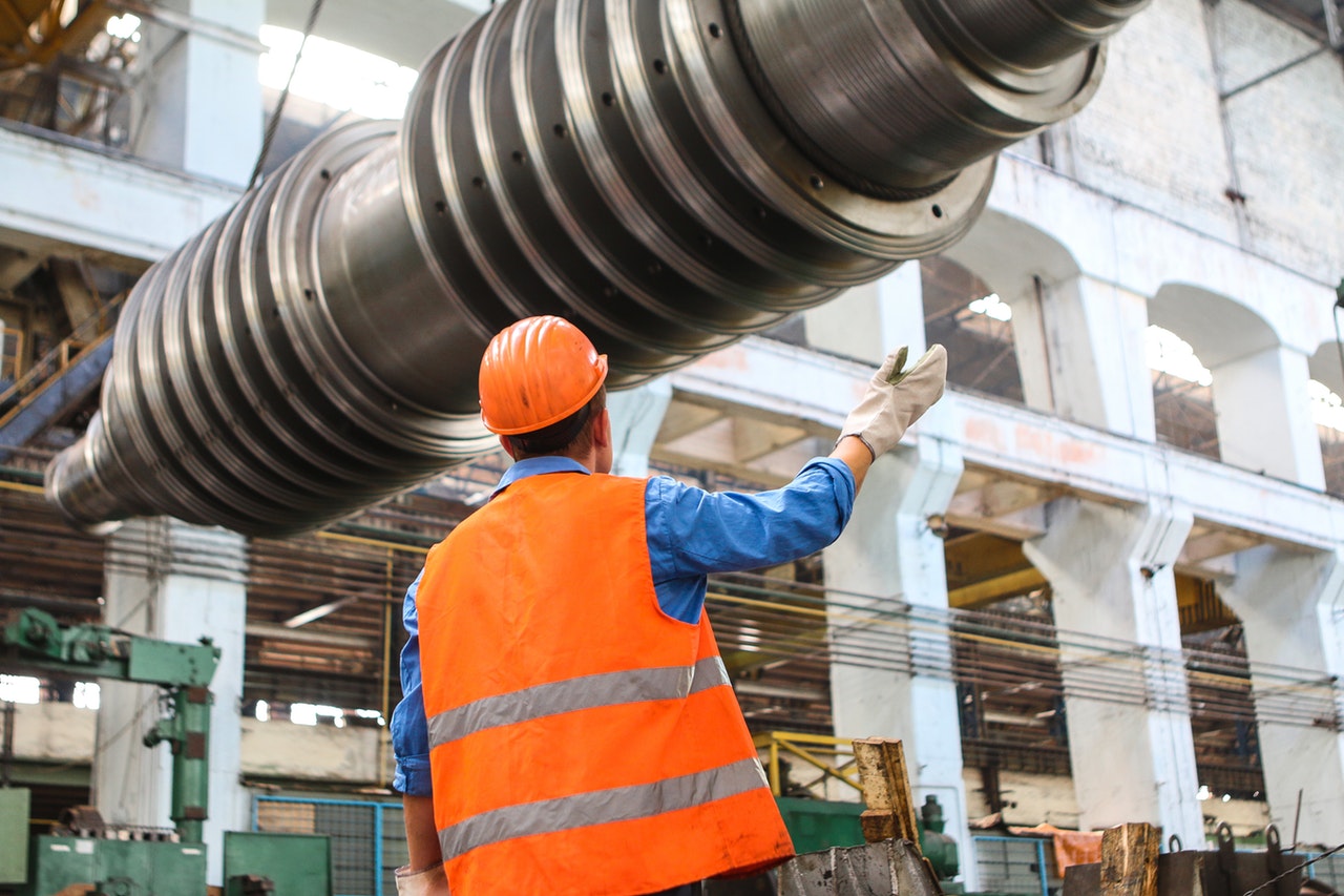 man standing near gray metal equipment 2760243